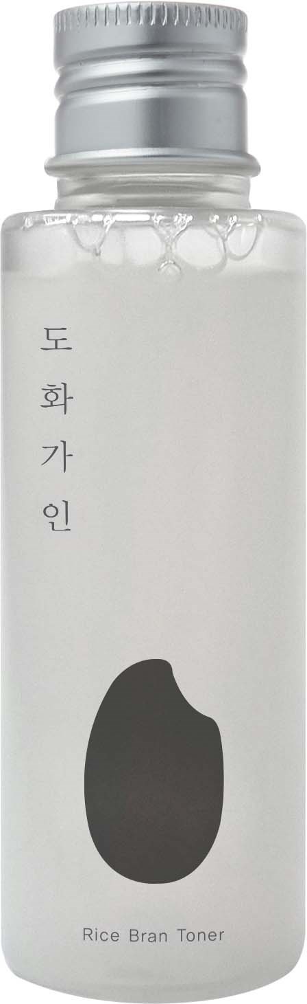 En vit flaska märkt 'Rice Bran Toner' med koreansk text och en svart form.