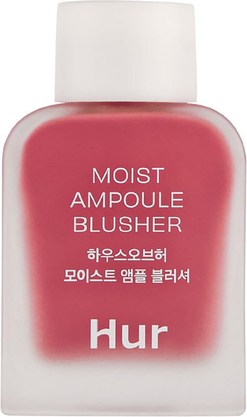Een kleine witte fles met roze label dat 'Moist Ampoule Blusher' en 'Hur' onderaan zegt.