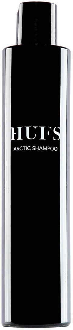 Eine lange schwarze Flasche mit weißen Text, gekennzeichnet 'HUF’S Arctic Shampoo,' hat einen glänzenden Deckel und elegantes Design.