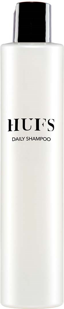 Eine lange, weiße Shampoo-Flasche mit schwarzem Deckel, beschriftet "HUFS DAILY SHAMPOO."
