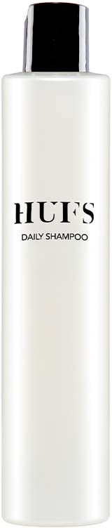 A tall white bottle labeled 'HUFS Daily Shampoo' with a black cap.