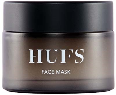 Ein grauer Behälter mit schwarzem Deckel, beschriftet 'HUFS Face Mask' in weißer Schrift.