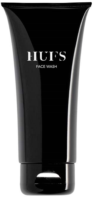 A black tube labeled HUFFS FACE WASH, likely a skincare product container.