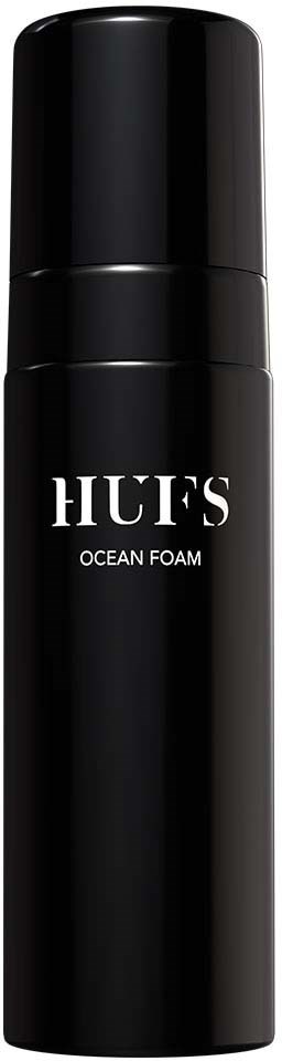 Tyylikäs musta pullo pumppulla, merkitty HUF'S Ocean Foam, tarkoitettu ihonhoitoon tai vartalonhoitoon.