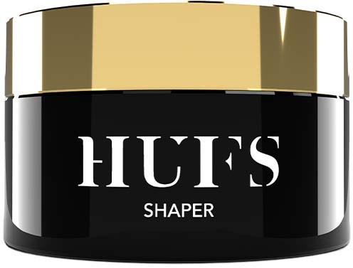 Een kleine zwarte pot met een gouden deksel, gelabeld 'HUFS Shaper.' Het is waarschijnlijk een cosmetisch product.