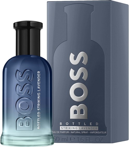 Een flesje BOSS Lavendel parfum naast de doos, beide met blauwe en grijze kleuren en vet wit tekst.