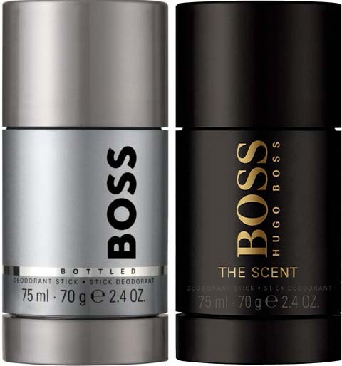 Twee deodorantsticks, de ene zilverkleurig met 'BOSS' en de andere zwart met goud 'BOSS THE SCENT' label.