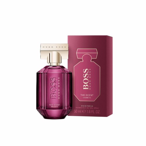 Een roze parfumfles met een gouden dop en bijpassend roze doos, gelabeld 'The Scent Magnetic' van Hugo Boss.