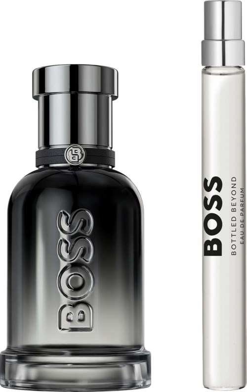 A black and silver Boss perfume bottle with a rounded cap and a slim white Boss fragrance pen.