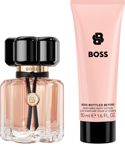 A perfume bottle with a black cap next to a pink body lotion tube, both labeled Boss.