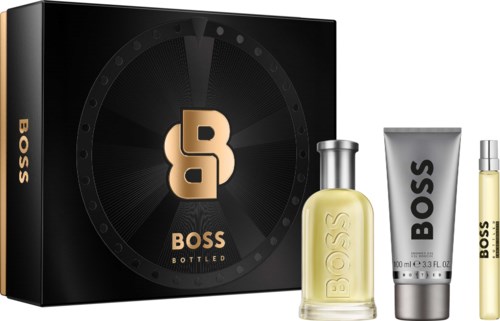 Boss Bottled perfume set with a black box, a perfume bottle, a cream tube, and a small spray bottle.