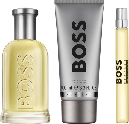 Boss perfume bottle, silver shower gel tube, and smaller perfume spray with Boss logo.