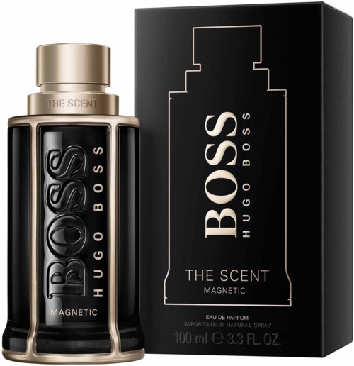 En svart Hugo Boss parfymlåda och flaska med guldkapsel och silverdetaljer. Text: 'BOSS THE SCENT MAGNETIC.'