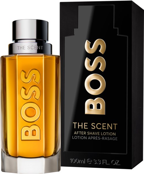A bottle and box of Boss after shave lotion, with a yellow-orange liquid and bold logo on bottle.
