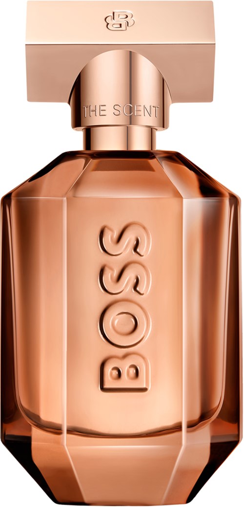 Een roségouden parfumfles met rechthoekige dop, gedrukt met het merk BOSS. De fles heeft een facetted, elegante vorm.