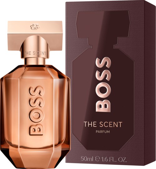 Een Boss parfumfles met doos, in perzik en bruintinten, elegant gevormd en gelabeld.