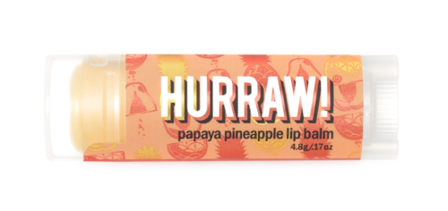 Eine kleine Tube mit Papaya-Ananas-Lippenbalsam mit buntem Etikett und weißem Schraubverschluss.
