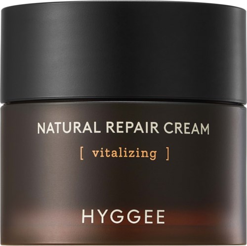 A dark brown jar labeled 'Natural Repair Cream' and 'Hygge' with a black lid.