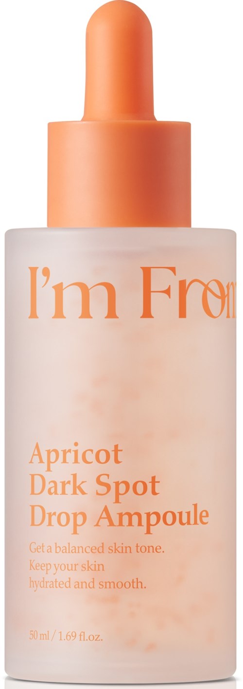 A bottle of skincare serum called Apricot Dark Spot Drop Ampoule with a pump top. The label is orange and white.