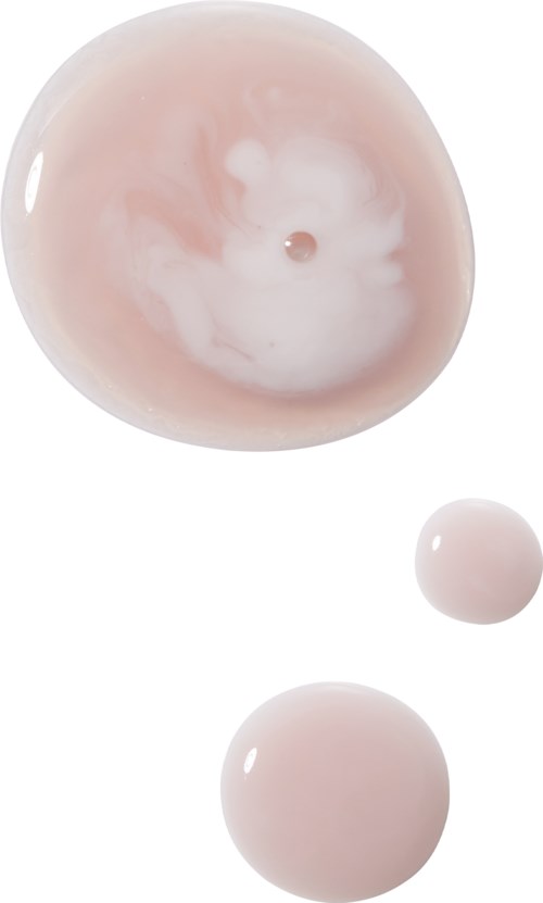 Drie ronde, zachte roze knoppen of kralen met glanzende oppervlakken en een marmerachtig patroon op de bovenste knop.