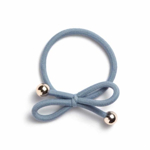 A light blue hair tie with a bow and metal beads, simple and cute accessory.