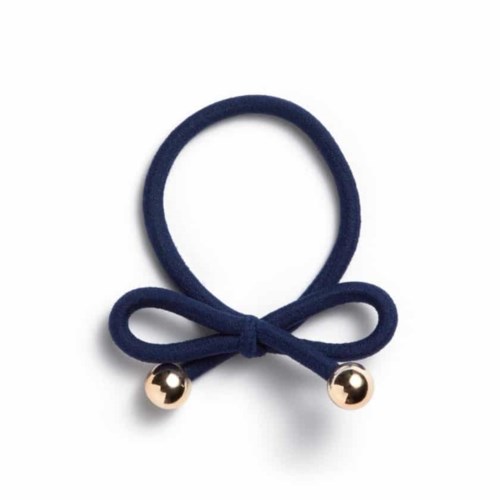 A navy blue elastic band with two small gold balls at the ends, shaped like a bow.