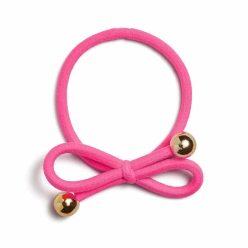 Pink hair tie with a bow and two gold balls. Simple and cute hair accessory.