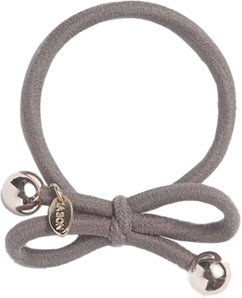 A gray fabric hair tie with a bow and silver bell charms.