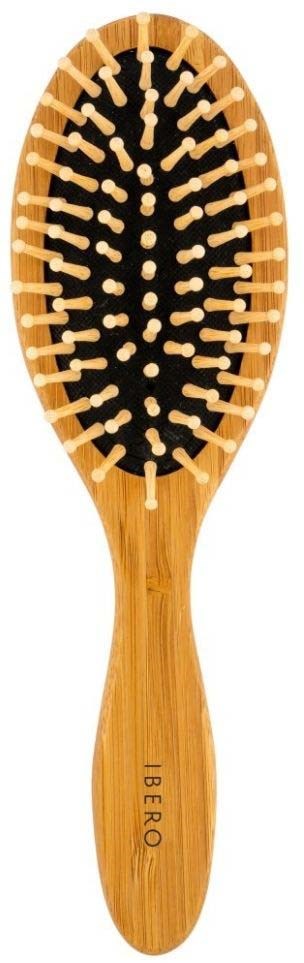 Eine Holzbürste mit schwarzen Borsten und einem Logo, das "IBERO" auf dem Griff sagt.