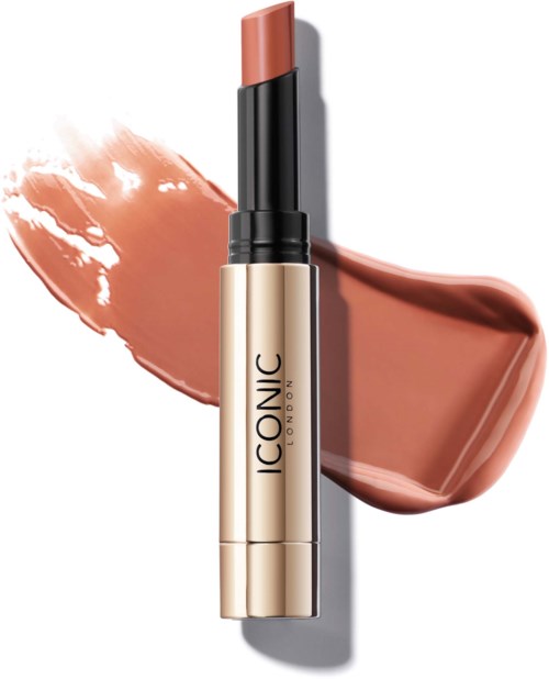 A lipstick in a black and gold tube with a peach-colored shade, with swatches showing its color and texture.