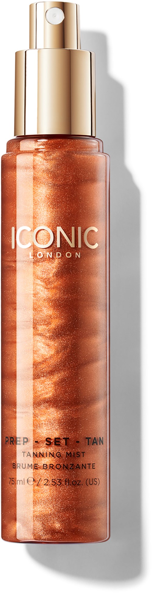 A tan tanning mist spray with a gold cap and white text reading 'ICONIC LONDON'.
