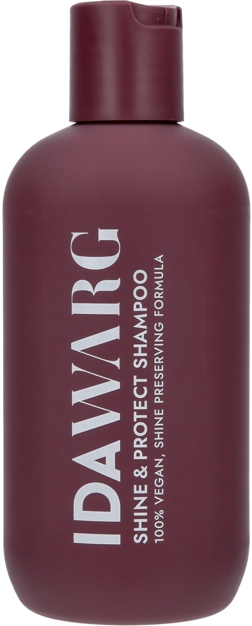 Een flesje IDAVIRG shampoo in donkerrood met een klep en label als veganistisch voor glans en bescherming.