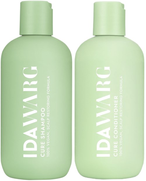 Two green bottles labeled "IDAVIRG" for scalp care, with one for shampoo and one for conditioner.