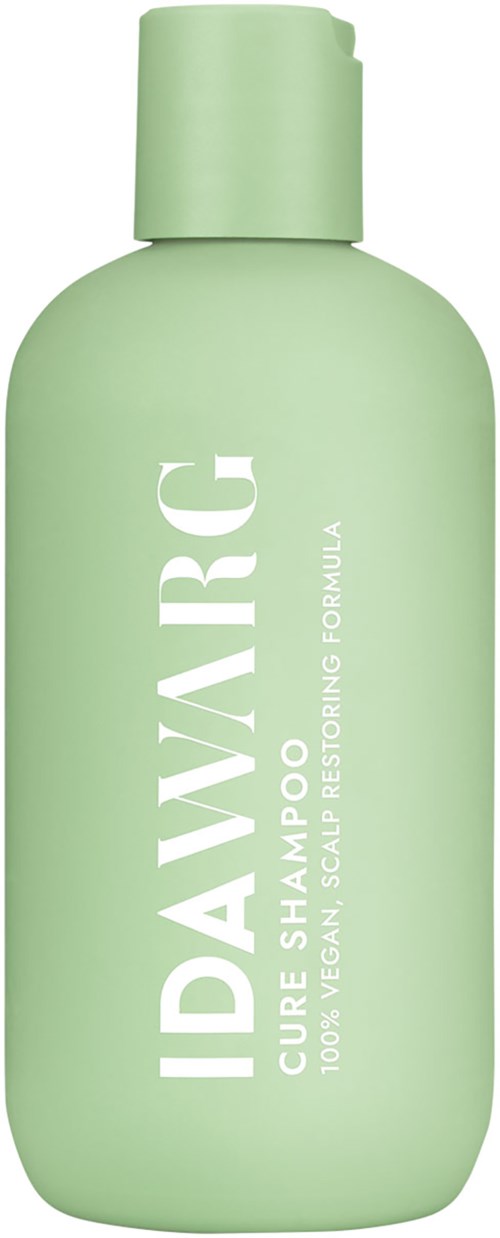 Groene fles met 'IDAWARC CURE SHAMPOO' erop en groene dop.