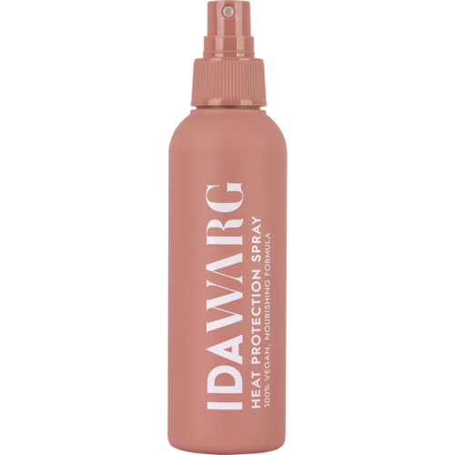 Roze sprayfles met IDAVIRG en tekst 'Herbal Protecting Spray' en 'Nourishing Formula'.