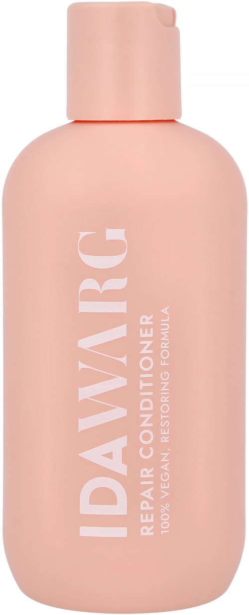 Ruusukuiduinen pullo, jossa on valkoinen teksti 'IDAVARIC' ja 'Repair Conditioner' vegaaniseen, korjaavaan hiustenhoitoon.