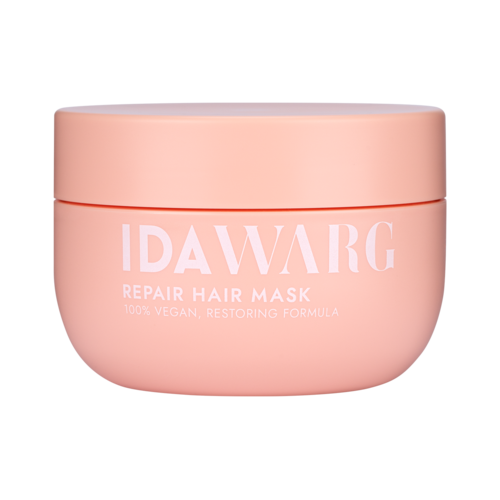 Een roze pot met IDAWARG Repair Hair Mask en productnaam op de voorkant.