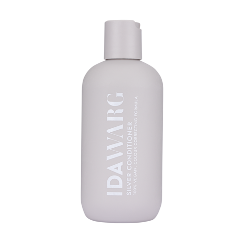 Eine weiße Flasche mit der Aufschrift 'IDAVARG Silver Conditioner' zum Färben und Pflegen grauer Haare.