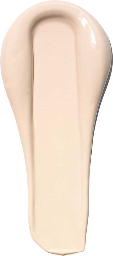 A beige or cream-colored liquid splash or smear with a rounded top and elongated shape.