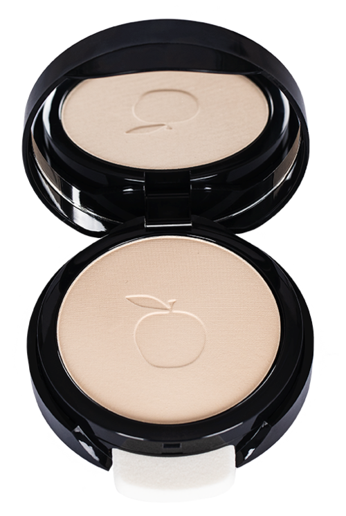 A round compact makeup with a beige pressed powder inside and an apple symbol embossed on it.