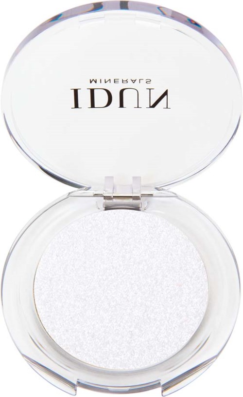 A round, open white makeup sponge compact with a clear lid and black text on the inside of the lid.