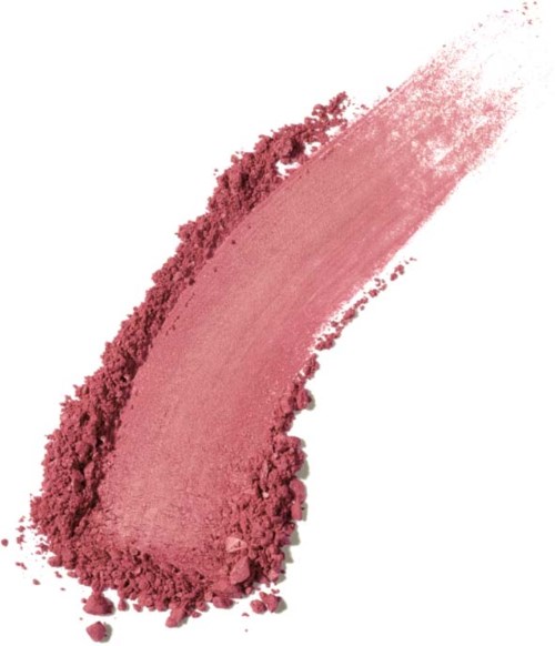 Pink powder with a curved streak, some loose particles, on a white background.