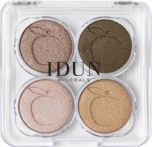 Four round eyeshadows in a plastic palette with peach, dark green, light pink, and shiny gold colors.