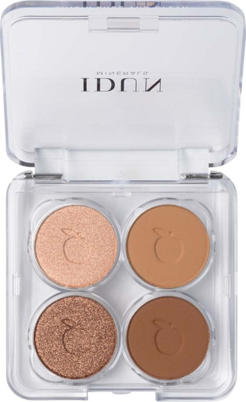 Four round makeup pans in a clear plastic case, two light shades and two darker shades. The case opens upward.