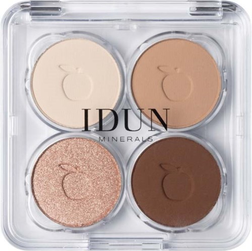 A makeup palette has four circular sections with different shades: beige, light brown, glittery rose, and dark brown.