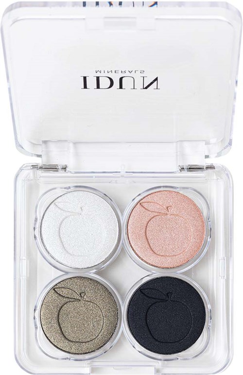 En liten makeuppalett med fyra skimrande ögonskuggsnyanser i vitt, rosa, guld och svart i ett genomskinligt fall.