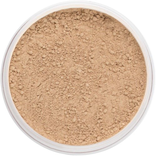 Loose beige powder in a round container, likely used for makeup or finishing touches.