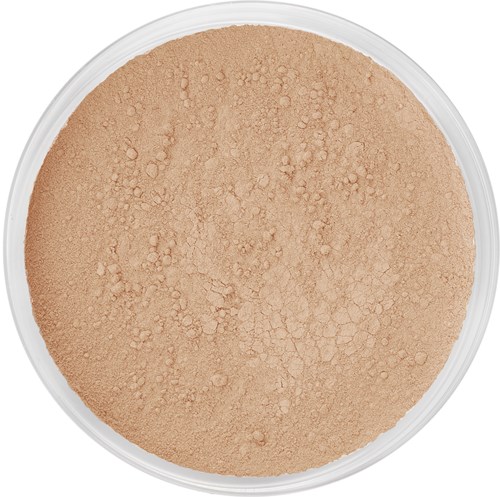 A round container holding loose, light brown powder with some small clumps on top.