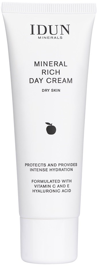 White tube of mineral-rich day cream with black text and small black peach icon.