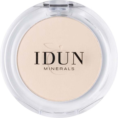 A compact makeup product with the brand name IDUN MINERALS on it, containing light-colored powder.